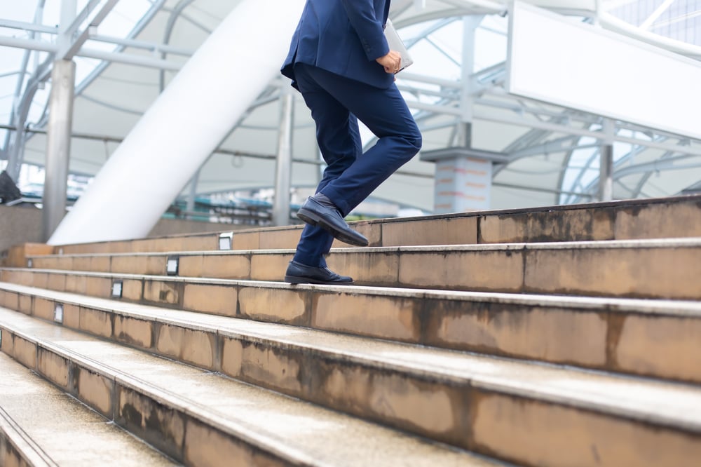 asian-businessman-wearing-suit-jacket-running-fast-upstairs-go-work-morning-outdoor