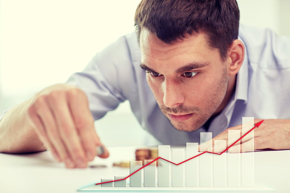 business-people-finances-statistics-money-saving-concept-businessman-putting-coins-into-piles-growing-chart