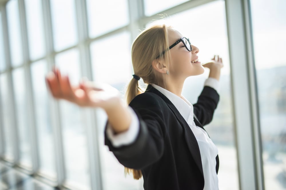 business-woman-excited-hold-hands-up-raised-arms-celebrate-victory-modern-office