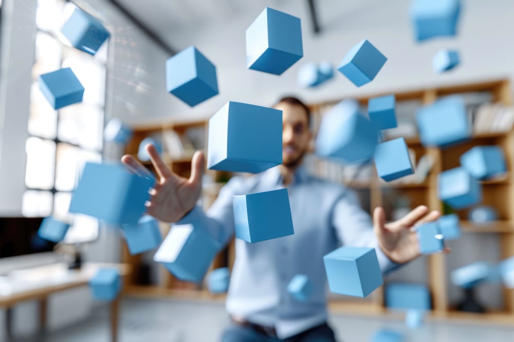businessman-interacting-with-3d-blue-shiny-cube-concept