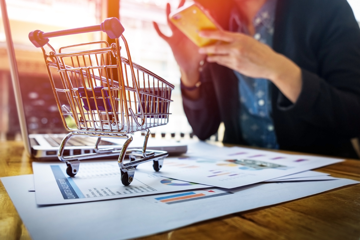 cropped-image-woman-inputting-card-information-key-phone-laptop-while-shopping-online-1