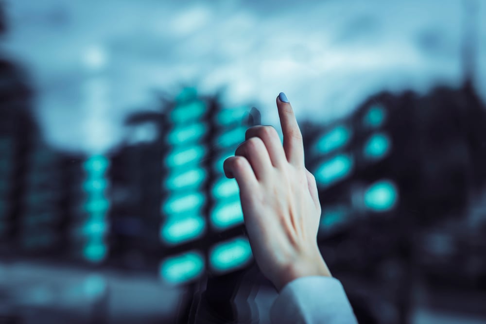 hand-touching-transparent-digital-screen
