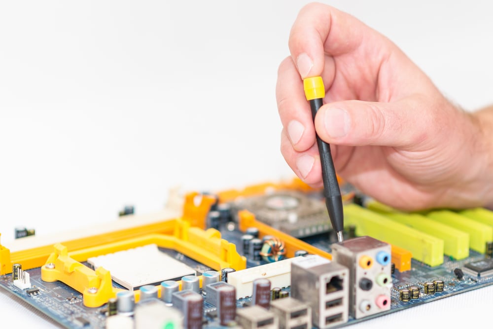 pc-disassembling-with-screwdriver-repair-shop-engineer-fixing-broken-computer-motherboard-electronic-renovation-technology-development-conceptselective-focuscopy-space