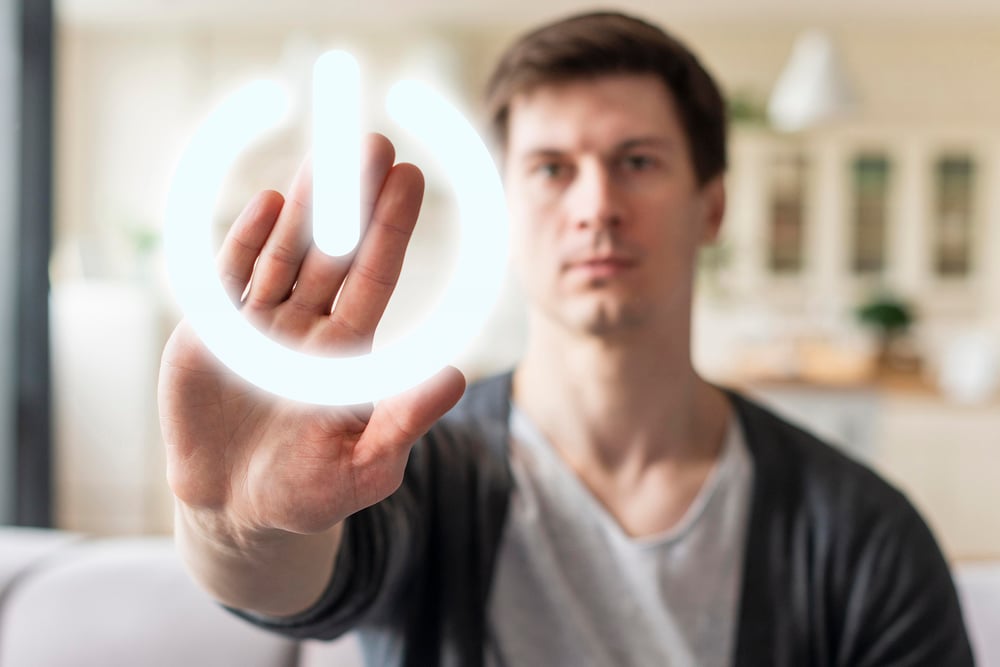 person-pressing-power-button