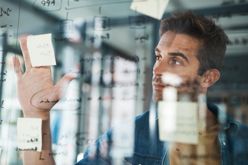 planning-man-glass-with-solution-startup-brainstorming-information-organizing-project-goal-entrepreneur-sticky-note-ideas-paper-reminder-timeline-agenda-schedule