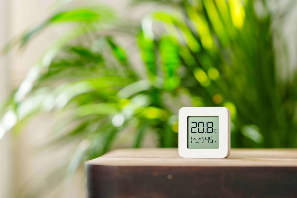 white-digital-thermometer-displaying-temperature-humidity
